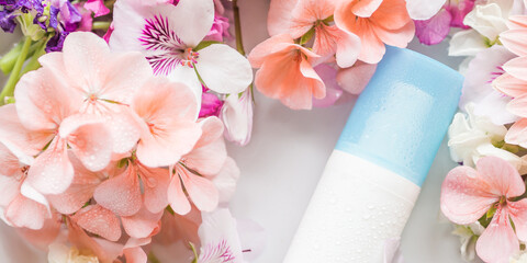 Face moisturizer in water in floral frame. Beauty skin care products concept. Banner