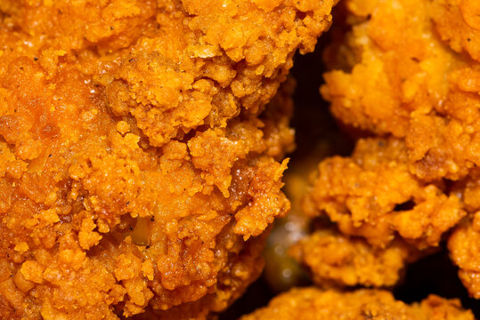 Fried chicken super crispy close up home made bow no brands with broccoli. Tasty and spicy unhealthy food