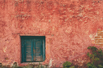 old red wall with windows