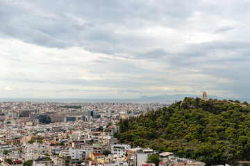 Fototapeta na wymiar Monument of Filopapo at Filopapo hill City of Athens, Greece view from sky, Bird Eye view, drone shot