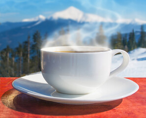 Tea cup with tea leaves on window. Tea time.