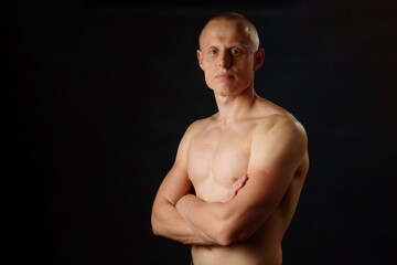 Strong Young Bearded 30s Posing On Dark Background Studio Portrait. Sport Fitness Healthy Lifestyle Concept. Copy Space.