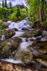 Mountain creek flowing during the spring snow melt