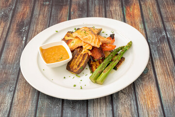 Grilled salmon dish with vegetables