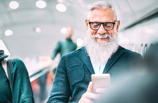 Hipster Bearded Man Using Mobile Smart Phone At Shopping Mall Elevators - Trendy Old Person Sharing Content With Smartphone - Happy Lifestyle And Technology Concept Without Age Limits - Azure Filter