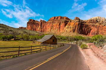 Highway 24 winding through Capital Reef national park past farmlands