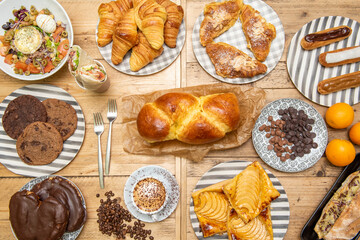 Set of pastry dishes on wooden background