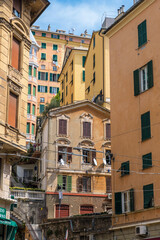 Fototapeta na wymiar Genoa, Italy - August 20, 2019: Beautiful view of old buildings and streets in Genoa, region of Liguria, Italy