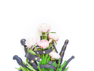 Flower layout for a sex shop. Various sex toys (didlo, handcuffs, balls and other) are on a white...