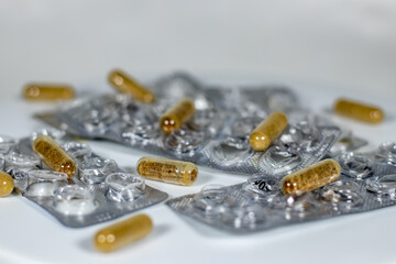 Pharmaceutical medicine, tablets and capsules in white background