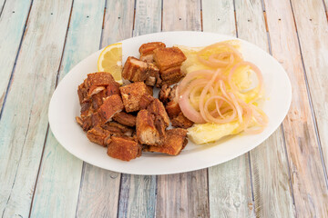 Dominican dish of pork rinds with cassava