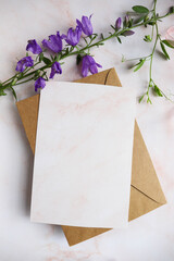 postcard mockup. flower composition. wildflowers on a white background and an envelope. congratulation. invitation. flat lay. place for text