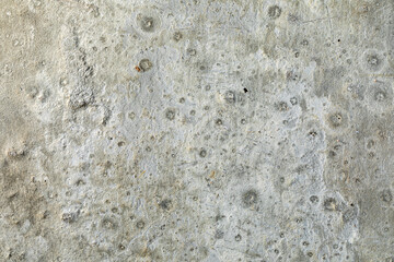 Detailed surface patterns and textures of grey concrete wall close up. Grunge background with copy space.