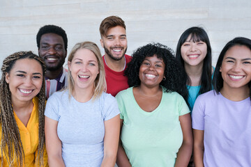 Happy multiracial peoples laughing - Portrait of a group young friends together - Concept of stop...