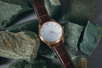 man watch on the stone background