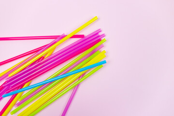 Plastic straws and earth globe, world pollution concept. Single use straws are on the war on plastic. There are plans to ban the sale of plastic straws to help reduce pollution