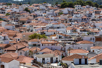 Panorama view over Skiathos town and its port, Skiathos island, Sporades, Greece. Island is a popular tourist destination for both local and foreign tourists.