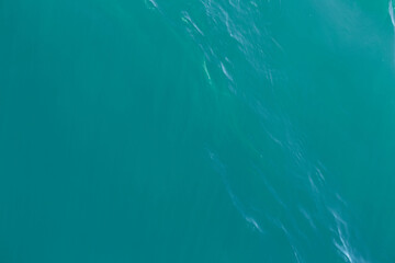 Turquoise or blue sea or ocean water. Close up. Top view. Water surface, background