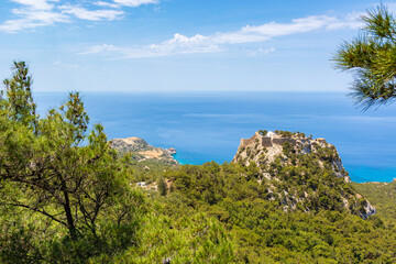 Fototapeta premium View of the west coast woth castle of Monolithos on the rock. Rhodes island.Greece.