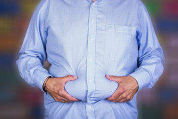 man with a big belly wearing  a shirt, holding his wheatwamp