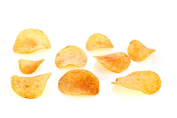 Classic potato chips. Fast food snack isolated on white background. A pile of crispy chips close-up as a background. Unhealthy food. Full depth of field.