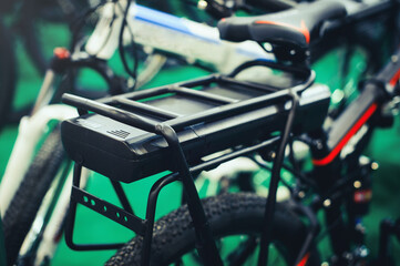 On the trunk is an electric bicycle battery