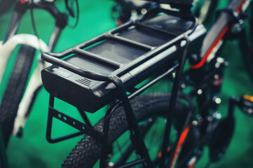 On the trunk is an electric bicycle battery