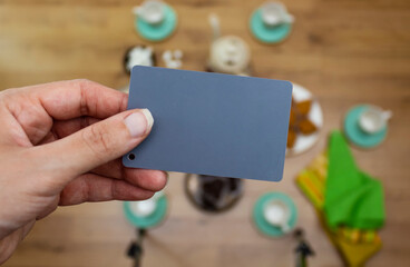 Grey card with a red strap, a photographer’s tool, determining the correct white balance