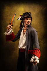 Portrait of a pirate, holding a musket gun in his hand