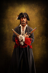 Naklejka premium Portrait of a pirate, holding two musket pistol in his hands