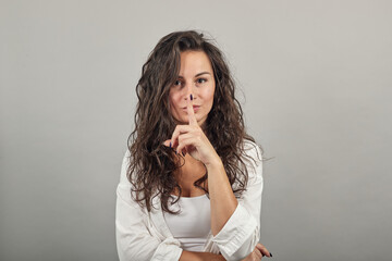 Index finger on lips, silence gesture, shhh quiet, asks for voicelessness forefinger at the mouth....
