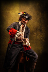 Portrait of a pirate in profile, drinking rum sitting in a tavern