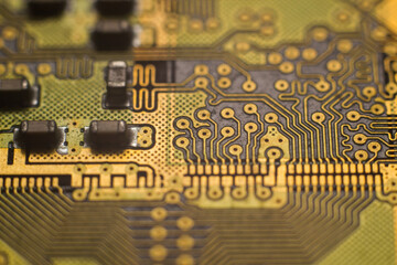 Macro photo of golden printed circuit board of high-speed memory module. Example of fine pitch PCB...