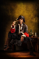 Portrait of a pirate smoking a pipe, sitting in a tavern