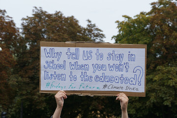 sign about education at climate protest 