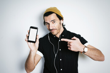 Portrait of a man holding smartphone with blank screen