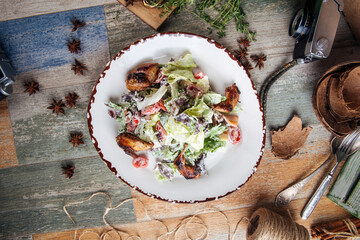 Salad with fried quail mushrooms and greens