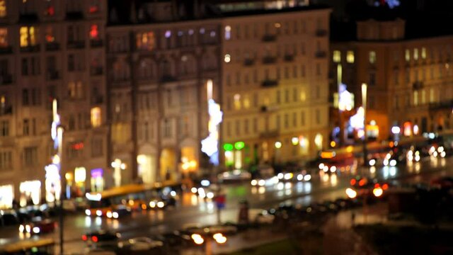 Warsaw, Poland aerial high angle above view on Warszawa Centralna central area with busy traffic cars and illuminated buildings at night abstract bokeh circles with seamless loop 