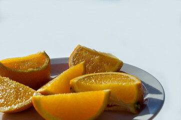 orange slices on plate in easter sunlight