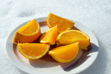 orange slices on plate in easter sunlight