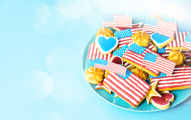 Happy 4th Of July - home baking cookies icing like american flag. patriotic background for US national holidays on blue 