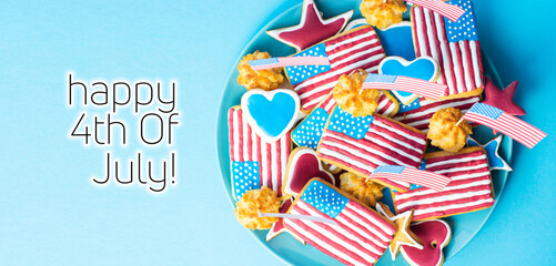 Happy 4th Of July - home baking cookies icing like american flag. patriotic background for US national holidays on blue 
