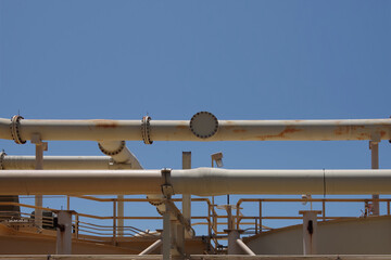Naklejka premium Partial view of a decommissioned former coastal gas and oil industry plant