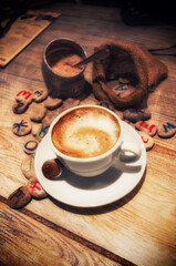 cup of coffee on the table in vintage grunge style. Selective focus