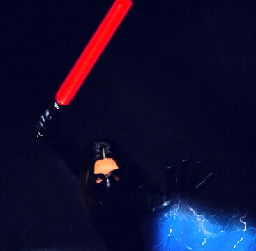 Young male model with mask posing in studio. Fantasy, Halloween, Sci-Fi concept.