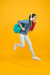 Fototapeta na wymiar Chase your dream. Energetic kid hurry to school. Happy child in energetic jump yellow background. Energetic mood. Healthy and energetic. School essentials. Hie yourself to back to school sale