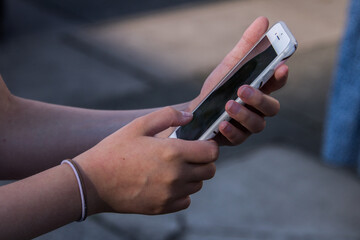 Young girl holding a smartphone