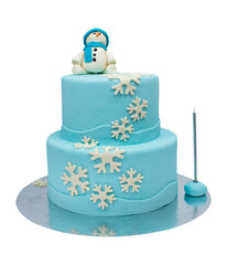 Two-layer blue cake. Cake with snowflakes and snowman on it. two-tiered blue snowman cake on isolated white background