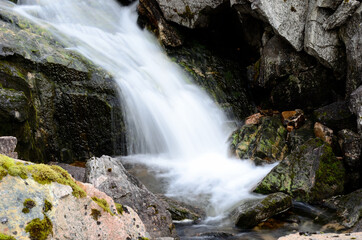 majestic small fresh water stream on mountain in summer