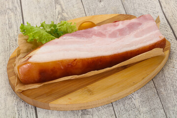 Smoked pork breast with salad leaves